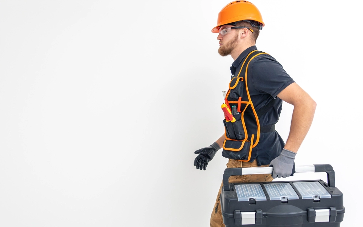 Electrician wearing safety gear and PPE helmet – professional electrical work standards